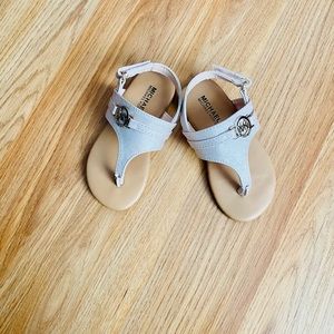 MK Plate Rose Silver Thong Sandals.